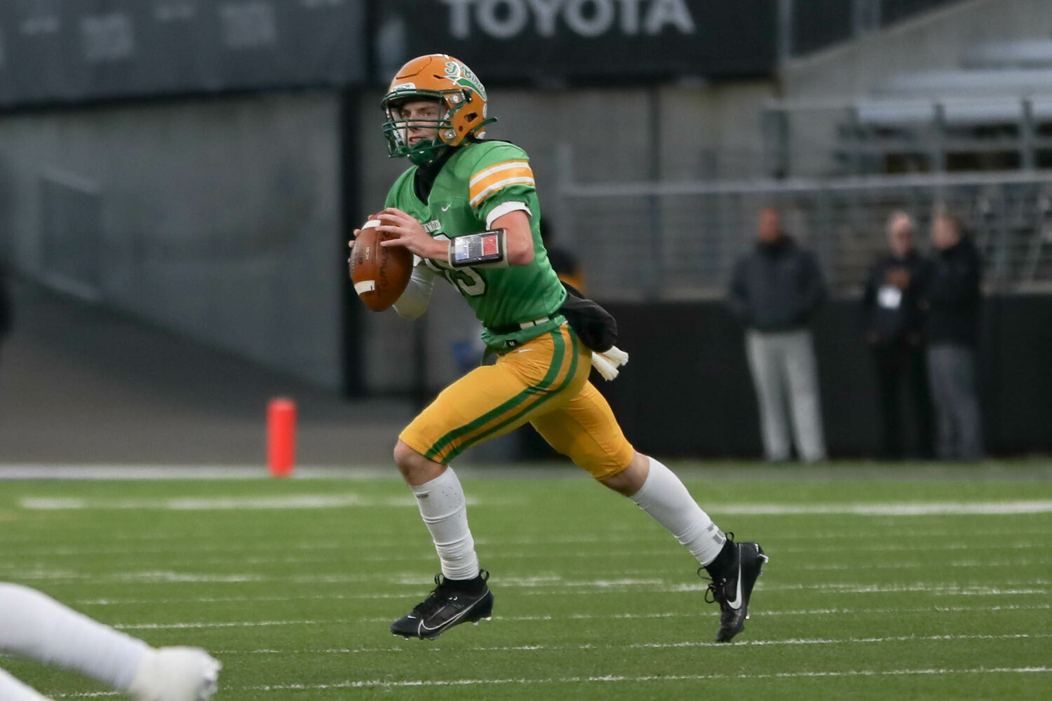 Tumwater QB Ethan Kastner looks to pass down field  during a 60-30 loss to Anacortes Dec. 2. at Husky Stadium.